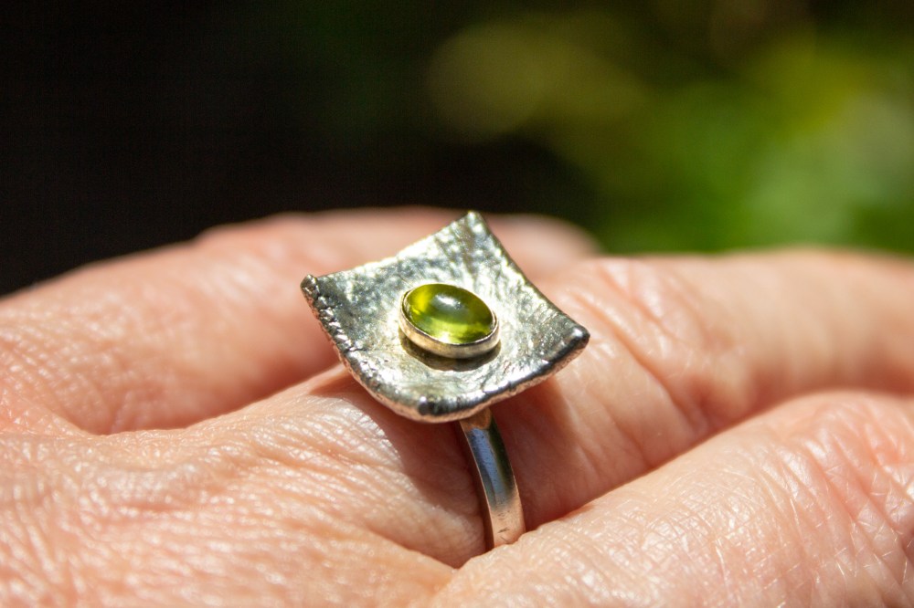 ring liquid silver peridot worn